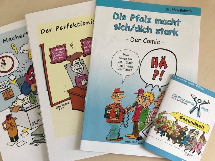 Eine Auswahl von Cartoonheftchen des Zeichners Steffen Boiselle zum Thema Resilienz